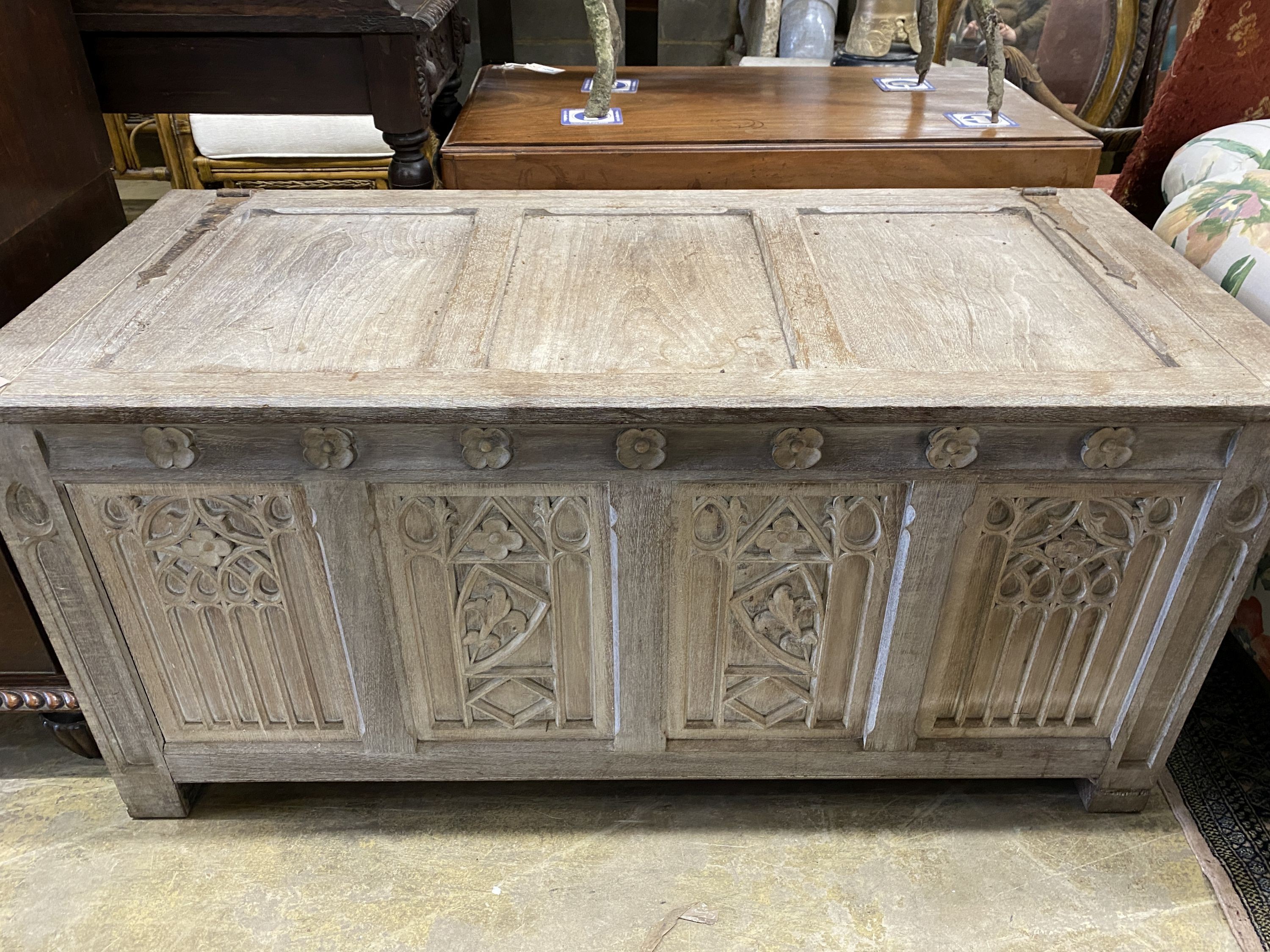 A 17th century style bleached oak coffer, length 136cm, depth 61cm, height 63cm